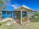 Back patio featuring wicker furniture and shade at 91 High St, Winter Haven, FL 33880