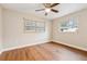 Bedroom featuring hardwood floors and a ceiling fan at 941 Grey Oak Ct, Orlando, FL 32809