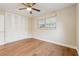 Bedroom with laminate floors, a ceiling fan, and closet at 941 Grey Oak Ct, Orlando, FL 32809