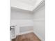 Walk-in closet with built-in shelving and wood-look flooring at 941 Grey Oak Ct, Orlando, FL 32809