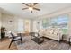 Bright and spacious living room featuring a neutral color palette, with a view to other rooms at 941 Grey Oak Ct, Orlando, FL 32809