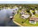 Aerial view of lakefront homes with lush landscaping, private pools, and docks at 4318 Waterfront Pkwy, Orlando, FL 32806