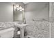 Modern bathroom featuring pedestal sink, decorative wall tiles, and a toilet at 4318 Waterfront Pkwy, Orlando, FL 32806