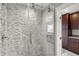 Bathroom featuring a glass-enclosed shower and dark wood cabinetry at 4318 Waterfront Pkwy, Orlando, FL 32806