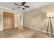 Bedroom with light wood floors, a closet, and neutral-colored walls at 4318 Waterfront Pkwy, Orlando, FL 32806