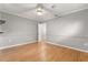 Bedroom featuring wood floors, neutral paint, and a open closet at 4318 Waterfront Pkwy, Orlando, FL 32806