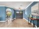 Inviting foyer with tiled flooring, elegant archways, and a view into the dining area at 4318 Waterfront Pkwy, Orlando, FL 32806