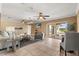 Open living room with ceiling fans, and sliding glass doors opening to backyard at 4318 Waterfront Pkwy, Orlando, FL 32806