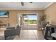 Comfortable living room with chairs, table and a view of the outdoor area at 4318 Waterfront Pkwy, Orlando, FL 32806