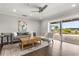 The spacious living room offers views of the pool, lake, and patio from the wide sliding door at 4318 Waterfront Pkwy, Orlando, FL 32806