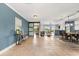 Open-concept living area with tile floors and views of the backyard and lake beyond at 4318 Waterfront Pkwy, Orlando, FL 32806