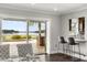 The living room offers stunning waterfront views, wet bar, and sliding doors to the outdoor patio at 4318 Waterfront Pkwy, Orlando, FL 32806