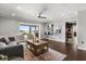 Bright living room with waterfront views, wet bar, ceiling fan, and comfortable seating at 4318 Waterfront Pkwy, Orlando, FL 32806