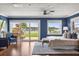 Bright main bedroom with waterfront views, wood floors, and stylish furnishings with a tranquil setting at 4318 Waterfront Pkwy, Orlando, FL 32806