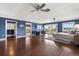 Open and spacious main bedroom with lake views, ceiling fans, and wood floors for a tranquil retreat at 4318 Waterfront Pkwy, Orlando, FL 32806