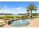 Beautiful pool and spa area with lush landscaping and peaceful lake views, perfect for outdoor relaxation at 4318 Waterfront Pkwy, Orlando, FL 32806