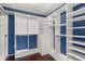 Well-organized walk-in closet with ample shelving and hanging space, maximizing storage and convenience at 4318 Waterfront Pkwy, Orlando, FL 32806