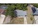 Aerial view of home showcasing mature trees and backyard at 1066 Swanson Dr, Deltona, FL 32738