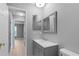 Bathroom features updated vanity and framed mirror at 1066 Swanson Dr, Deltona, FL 32738