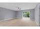 Neutral bedroom featuring a ceiling fan and a sliding glass door to the outside at 1066 Swanson Dr, Deltona, FL 32738
