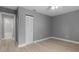 Bright bedroom featuring a ceiling fan, spacious closet, light-colored flooring and neutral walls at 1066 Swanson Dr, Deltona, FL 32738