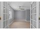 Neutral bedroom with french doors leading to other rooms at 1066 Swanson Dr, Deltona, FL 32738