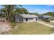 Single-story home featuring traditional architecture, landscaping, and a driveway at 1066 Swanson Dr, Deltona, FL 32738