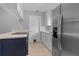 Modern kitchen features stainless steel refrigerator and white cabinets at 1066 Swanson Dr, Deltona, FL 32738