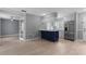 Open kitchen with stainless steel appliances, and gray and navy blue color scheme at 1066 Swanson Dr, Deltona, FL 32738