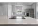 Well-lit kitchen boasting quartz counters, stainless steel appliances, and stylish backsplash at 1066 Swanson Dr, Deltona, FL 32738