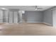Spacious living area with light wood flooring and neutral walls at 1066 Swanson Dr, Deltona, FL 32738