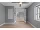 Living space with light wood flooring and french doors at 1066 Swanson Dr, Deltona, FL 32738