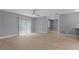 Spacious living room with sliding glass door and french doors to other rooms at 1066 Swanson Dr, Deltona, FL 32738