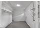 Storage room with block walls, shelving and exterior door at 1066 Swanson Dr, Deltona, FL 32738