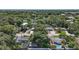 Aerial shot highlights property in a tree-filled neighborhood with nearby amenities and serene atmosphere at 116 E Lauren Ct, Fern Park, FL 32730