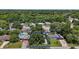 Aerial view of the property showcases its location amongst lush trees and a charming residential neighborhood at 116 E Lauren Ct, Fern Park, FL 32730