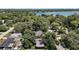 Aerial view reveals home's location among beautiful trees and tranquil surroundings near a large lake at 116 E Lauren Ct, Fern Park, FL 32730