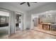 Open-concept living and dining areas with tiled floors and access to the screened patio at 116 E Lauren Ct, Fern Park, FL 32730