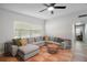 Bright living room featuring a comfortable sectional sofa and ample natural light at 116 E Lauren Ct, Fern Park, FL 32730