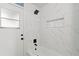 Contemporary bathroom featuring a tiled shower and tub, complemented by sleek black fixtures at 1161 Roxboro Rd, Longwood, FL 32750