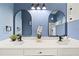 Bathroom featuring double sinks, black hardware, and walk-in shower at 1161 Roxboro Rd, Longwood, FL 32750