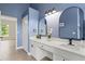 Spacious bathroom featuring double sinks, modern fixtures, and views of the outdoors at 1161 Roxboro Rd, Longwood, FL 32750