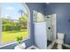 Bright bathroom featuring a glass shower, a window with a view of the backyard, and fresh decor at 1161 Roxboro Rd, Longwood, FL 32750