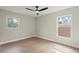 Bright bedroom with two windows and new floors at 1161 Roxboro Rd, Longwood, FL 32750
