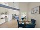 Dining area with vaulted ceilings flows into the kitchen, highlighted by wood-look floors and bright, natural light at 1161 Roxboro Rd, Longwood, FL 32750