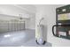 Garage featuring epoxy flooring, updated garage door, and modern appliances at 1161 Roxboro Rd, Longwood, FL 32750