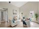 Bright living room featuring vaulted ceilings, wood-look floors, and modern furnishings with lots of natural light at 1161 Roxboro Rd, Longwood, FL 32750