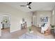 Open-concept living room with hardwood floors, vaulted ceiling and natural light, creating a cozy ambiance at 1161 Roxboro Rd, Longwood, FL 32750