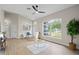 Spacious and bright living room featuring hardwood floors, vaulted ceilings, and an abundance of natural light at 1161 Roxboro Rd, Longwood, FL 32750
