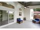 Relaxing screened patio with cozy seating, ceiling fan and lots of natural light at 1161 Roxboro Rd, Longwood, FL 32750